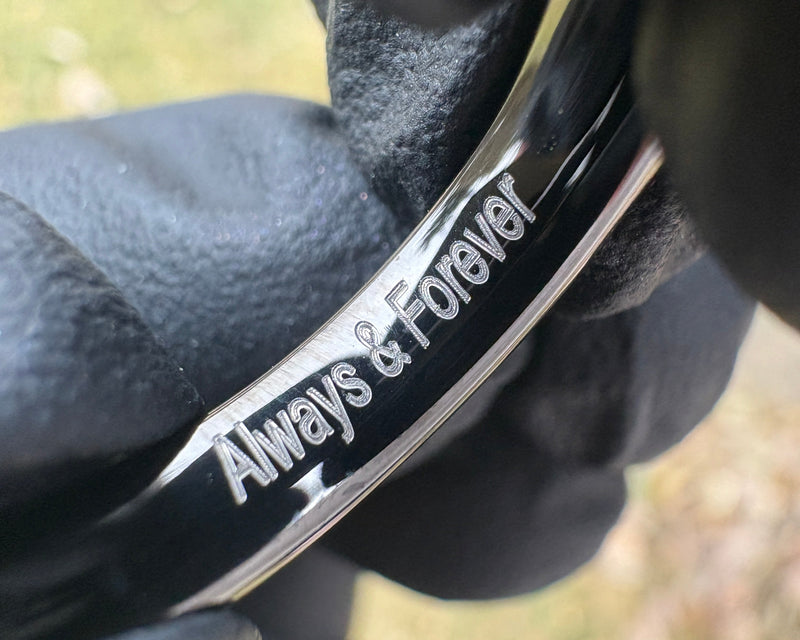 Close up of engraved ring with the message 'Always & Forever'