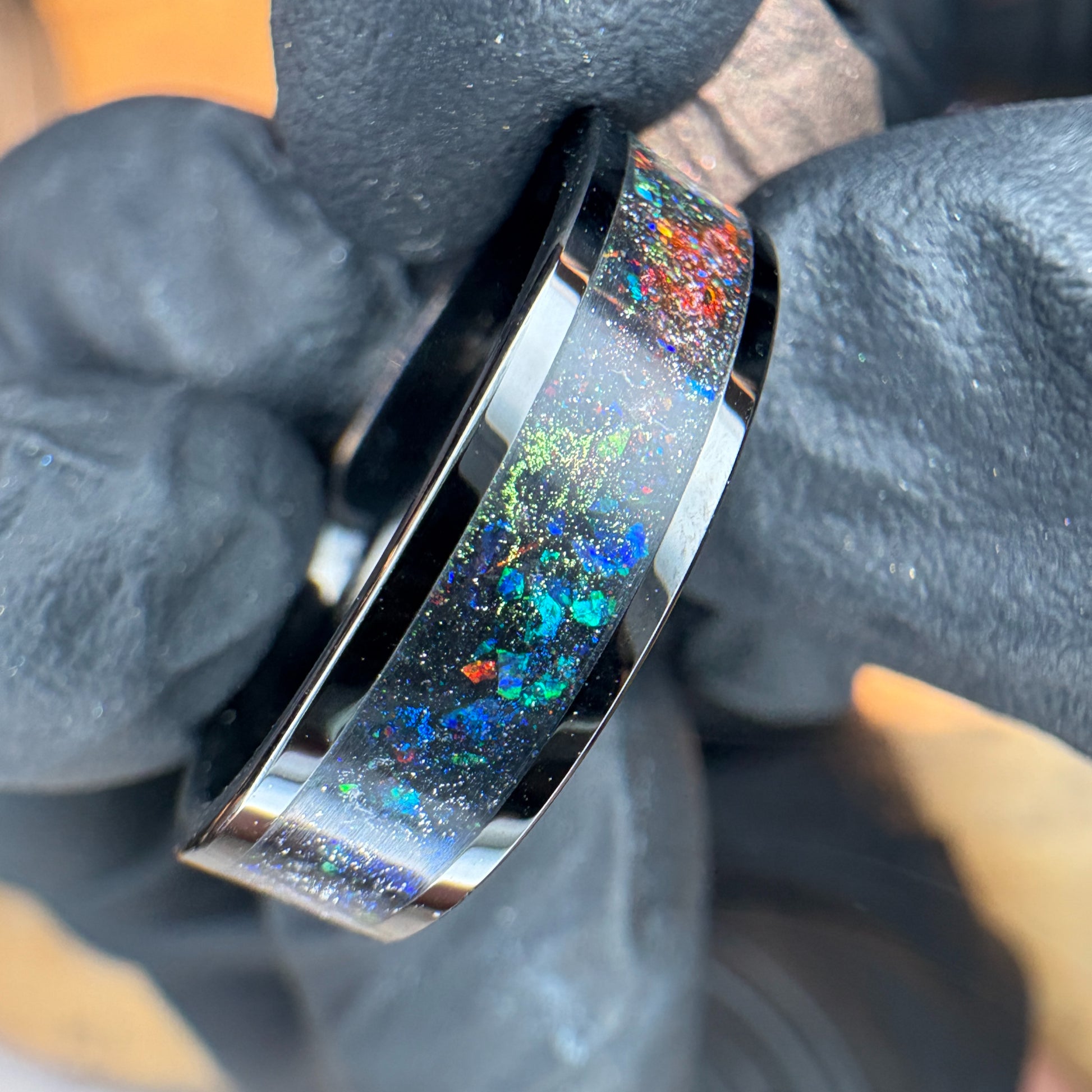 Black plated tungsten ring with multi color space themed shifting pigment powders and synthetic opals 