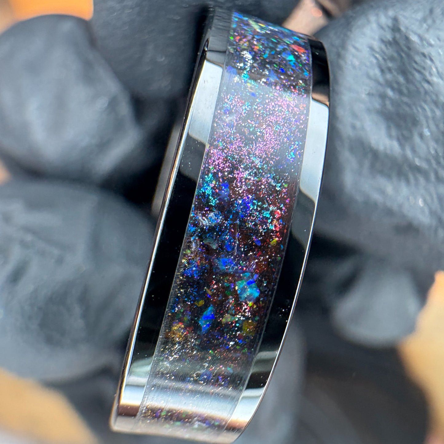 Black plated tungsten ring with multi color space themed shifting pigment powders and synthetic opals 