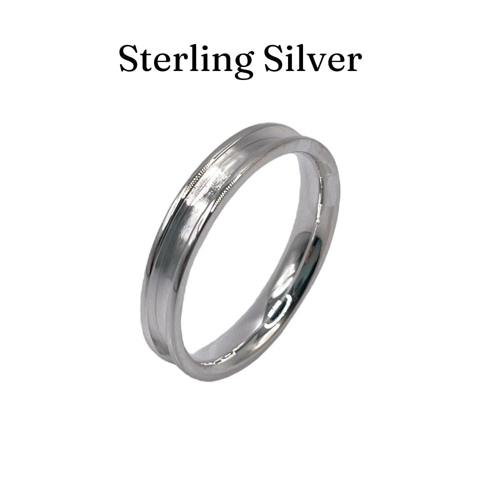 Silver ring with 'Sterling Silver' text on a white background